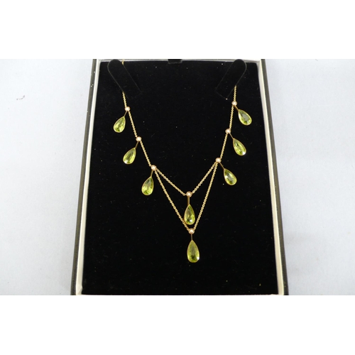 177 - 15ct gold pear shaped peridot and seed pearl necklace (eight peridots, length 10mm each)