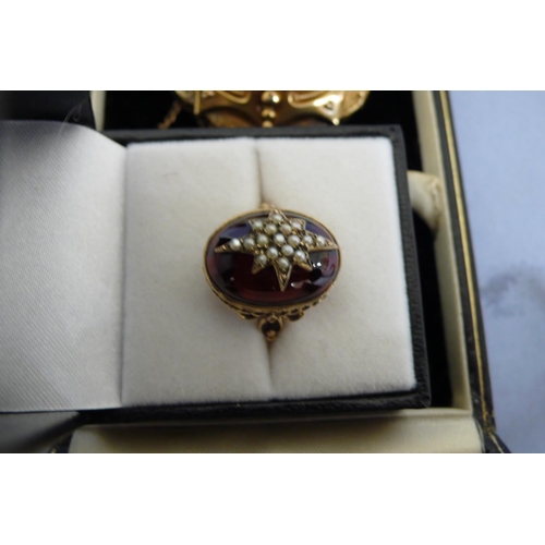 181 - Victorian style 9ct gold ring with cabochon garnet inset with gold set star of seed pearls, Size M. ... 