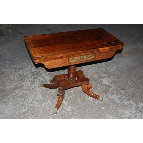 69 - Regency Rosewood Swivel Top Folding Card Table with Brass stringing on Sabre Legs