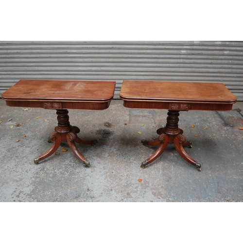 74 - Pair of W IV Mahogany swivel top folding tea tables with turned columns and quadruple sabre legs and... 