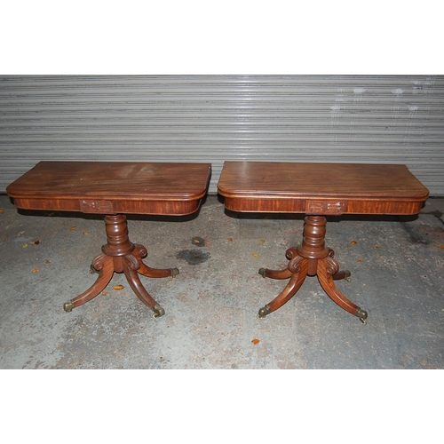 74 - Pair of W IV Mahogany swivel top folding tea tables with turned columns and quadruple sabre legs and... 