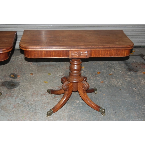 74 - Pair of W IV Mahogany swivel top folding tea tables with turned columns and quadruple sabre legs and... 