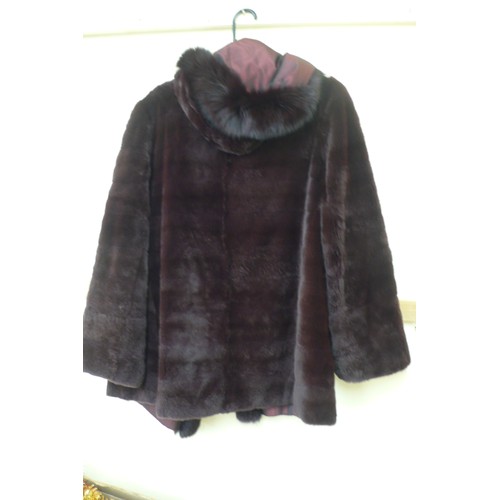 421 - Ladies reversible burgundy fur coat with hood and fur trim - size 14