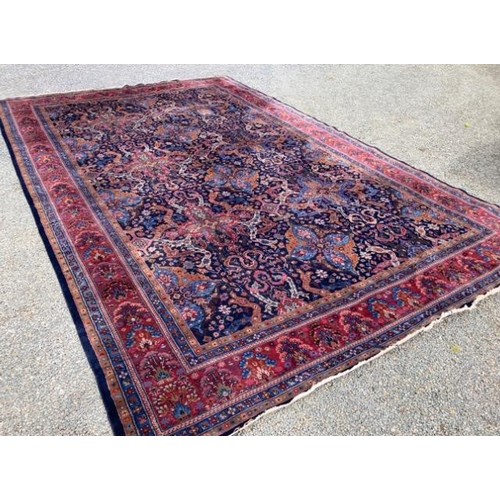 424 - Large hand-made Middle Eastern carpet with eight borders surrounding stylized floral and foliate des... 