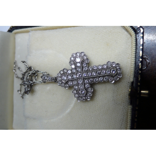 425 - Multistone diamond cross set in platinum