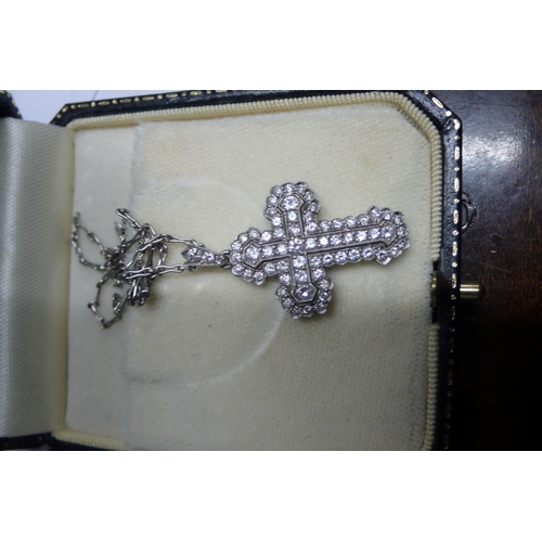 425 - Multistone diamond cross set in platinum