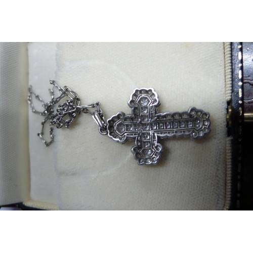 425 - Multistone diamond cross set in platinum