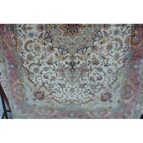 427 - A good quality Persian silk and wool mix carpet with floral decoration in multicoloures 8ft X 5ft 6i... 