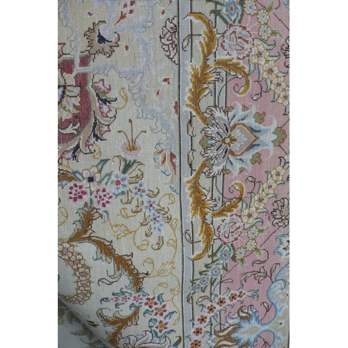 427 - A good quality Persian silk and wool mix carpet with floral decoration in multicoloures 8ft X 5ft 6i... 