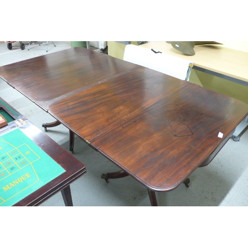 74 - Pair of W IV Mahogany swivel top folding tea tables with turned columns and quadruple sabre legs and... 