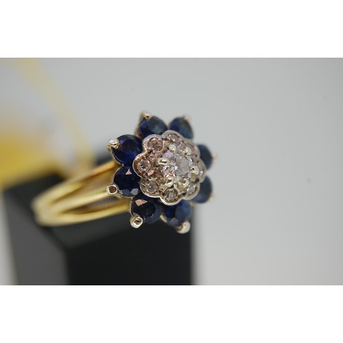 175 - An 18ct Gold Sapphire and Diamond Cluster ring (Tested), Size N