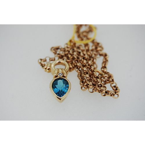 179 - 14ct gold necklace with pear drop blue topaz and diamond pendant. Total weight 8.6grms