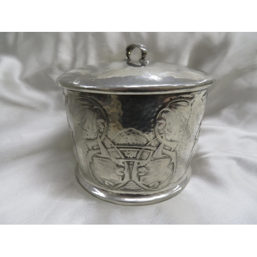 115 - Archibald Knox for Liberty & Co
Pewter biscuit box of cylindrical form with chased leaf and entwined... 