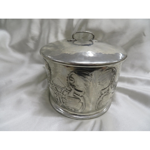 115 - Archibald Knox for Liberty & Co
Pewter biscuit box of cylindrical form with chased leaf and entwined... 