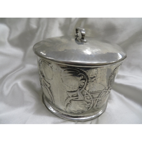 115 - Archibald Knox for Liberty & Co
Pewter biscuit box of cylindrical form with chased leaf and entwined... 