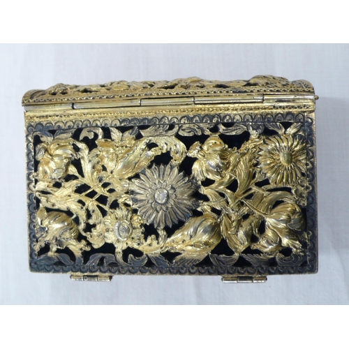 230 - Late 19thC silver Gilt pierced book cover with decoration of flowers, the clasps inset with garnets,... 