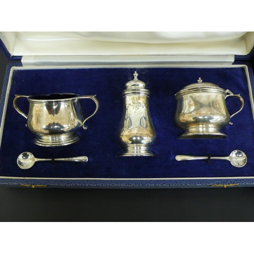 238 - Cased Garrard & Co silver salt, pepper and mustard, plus two spoons, plus another cased set, London ... 