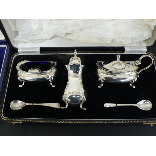 238 - Cased Garrard & Co silver salt, pepper and mustard, plus two spoons, plus another cased set, London ... 