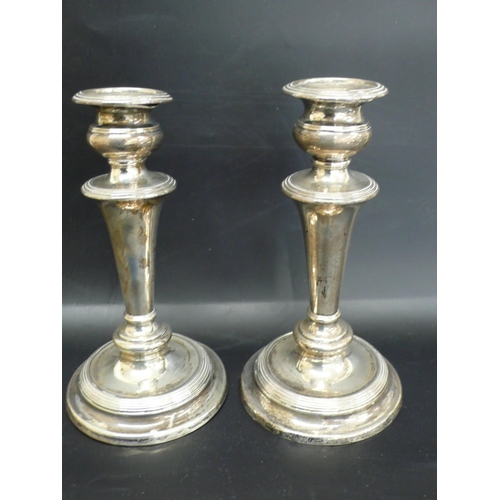 242 - William IV loaded silver candlesticks with reeded borders, tapering columns and circular bases, Shef... 