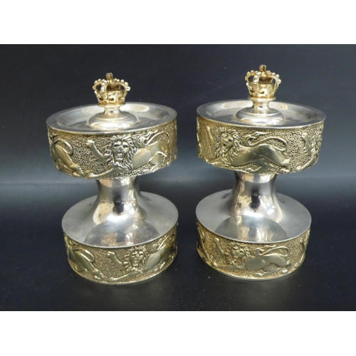 243 - Pair of Anthony Elson designed parcel Britannia silver gilt pepper grinders with Regal decoration ma... 