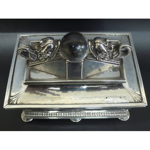 244 - Omar Ramsden rectangular silver casket with two dolphins facing each other holding a glass orb in th... 