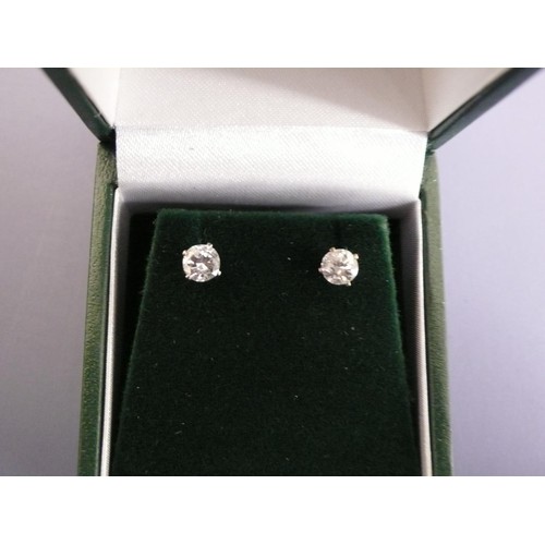 373 - Pair of diamond ear studs set in silver, 0.71cts total