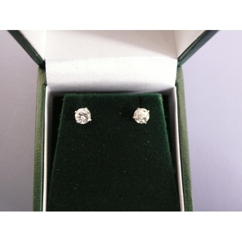 373 - Pair of diamond ear studs set in silver, 0.71cts total