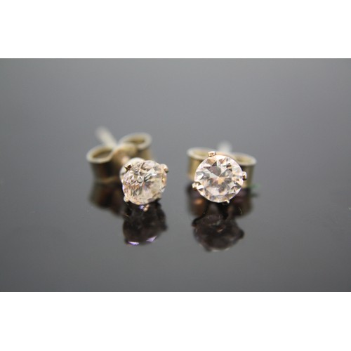 373 - Pair of diamond ear studs set in silver, 0.71cts total