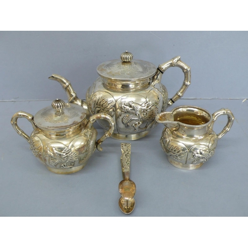 1 - Four piece Cantonese chased silver tea set with decoration of turned fluted finial, bamboo handles a... 