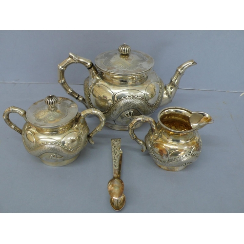 1 - Four piece Cantonese chased silver tea set with decoration of turned fluted finial, bamboo handles a... 