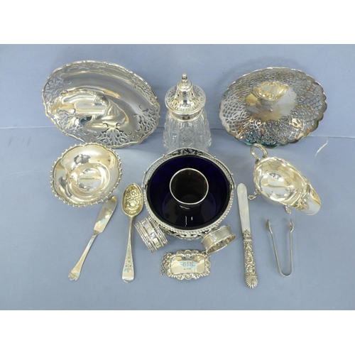 10 - A collection of silver, three pierced bon bon dishes one swing handled, small comport, sauceboat, si... 