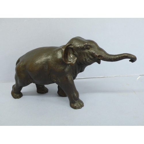 11 - Late 19thC Japanese black patinated bronze Asian elephant, length 11.5ins, height 6ins, marked to be... 