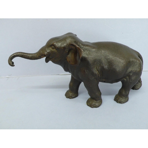 11 - Late 19thC Japanese black patinated bronze Asian elephant, length 11.5ins, height 6ins, marked to be... 