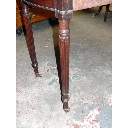 111 - Circular drop leaf mahogany dining table in the style of Gillow with turned tapering reeded legs and... 