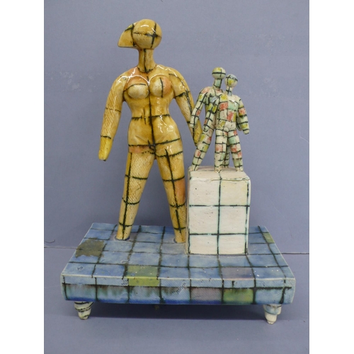 126 - Martin Hearne, Mannequins on pedestals, porcelain with multicoloured glazes, ht. 9.75ins