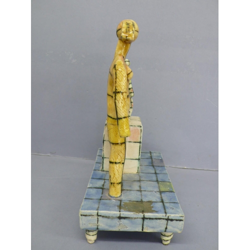 126 - Martin Hearne, Mannequins on pedestals, porcelain with multicoloured glazes, ht. 9.75ins