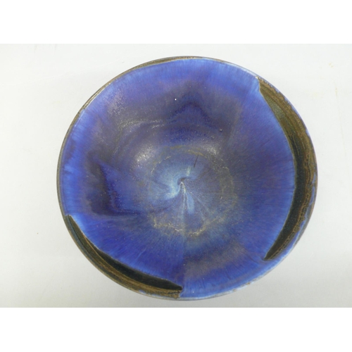 129 - Mary Rich, conical shaped porcelain bowl with small circular foot in blue and black glazes, height 4... 