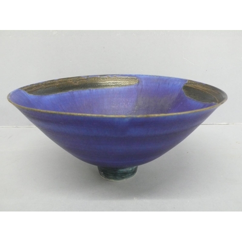 129 - Mary Rich, conical shaped porcelain bowl with small circular foot in blue and black glazes, height 4... 