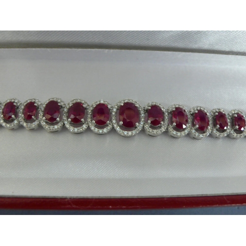 133 - 18ct white gold graduated ruby and diamond cluster bracelet, approx 12cts of rubies and 2.5cts of di... 