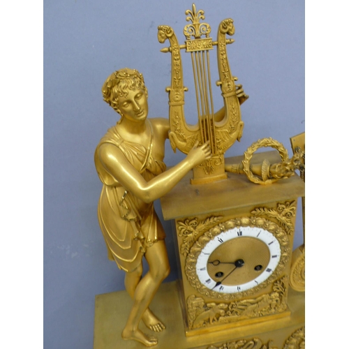 140 - An early 19thC French ormolu mantel clock with figure playing a lyre to top, white enamel chapter ri... 