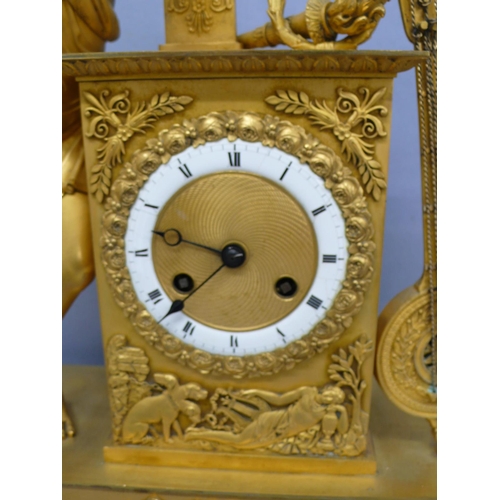 140 - An early 19thC French ormolu mantel clock with figure playing a lyre to top, white enamel chapter ri... 