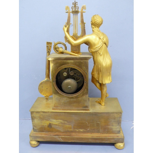 140 - An early 19thC French ormolu mantel clock with figure playing a lyre to top, white enamel chapter ri... 