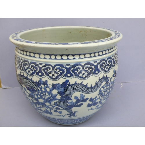 148 - 19thC  Chinese blue and white porcelain jardinaire with decoration of pendant ruyi heads above four ... 