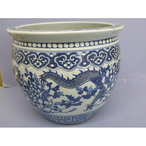 148 - 19thC  Chinese blue and white porcelain jardinaire with decoration of pendant ruyi heads above four ... 