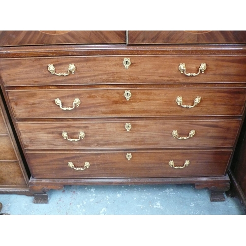 164 - Flame mahogany linen press with oval panels to top, crossbanded in satinwood and tulip wood, four dr... 