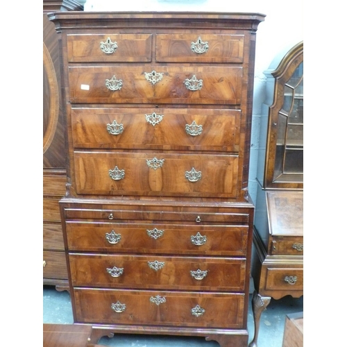 165 - George III walnut chest on chest with crossbanded drawers, reeded canted corners, pierced brass escu... 