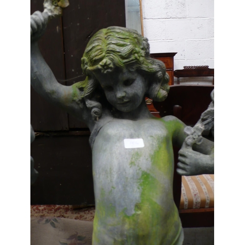 186 - A lead figure of a child holding a garland aloft - height 48 ins approx