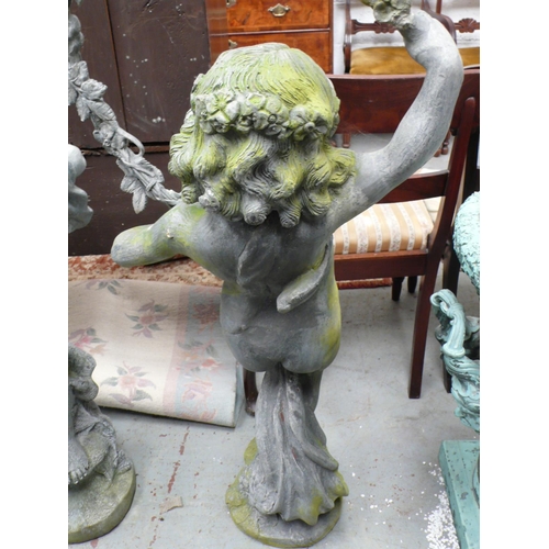 186 - A lead figure of a child holding a garland aloft - height 48 ins approx