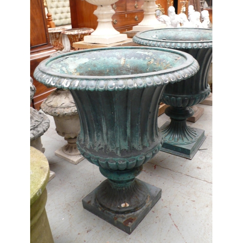 191 - A large pair of painted metal fluted garden urns with gadrooned borders on square bases - Height 31 ... 