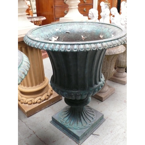 191 - A large pair of painted metal fluted garden urns with gadrooned borders on square bases - Height 31 ... 